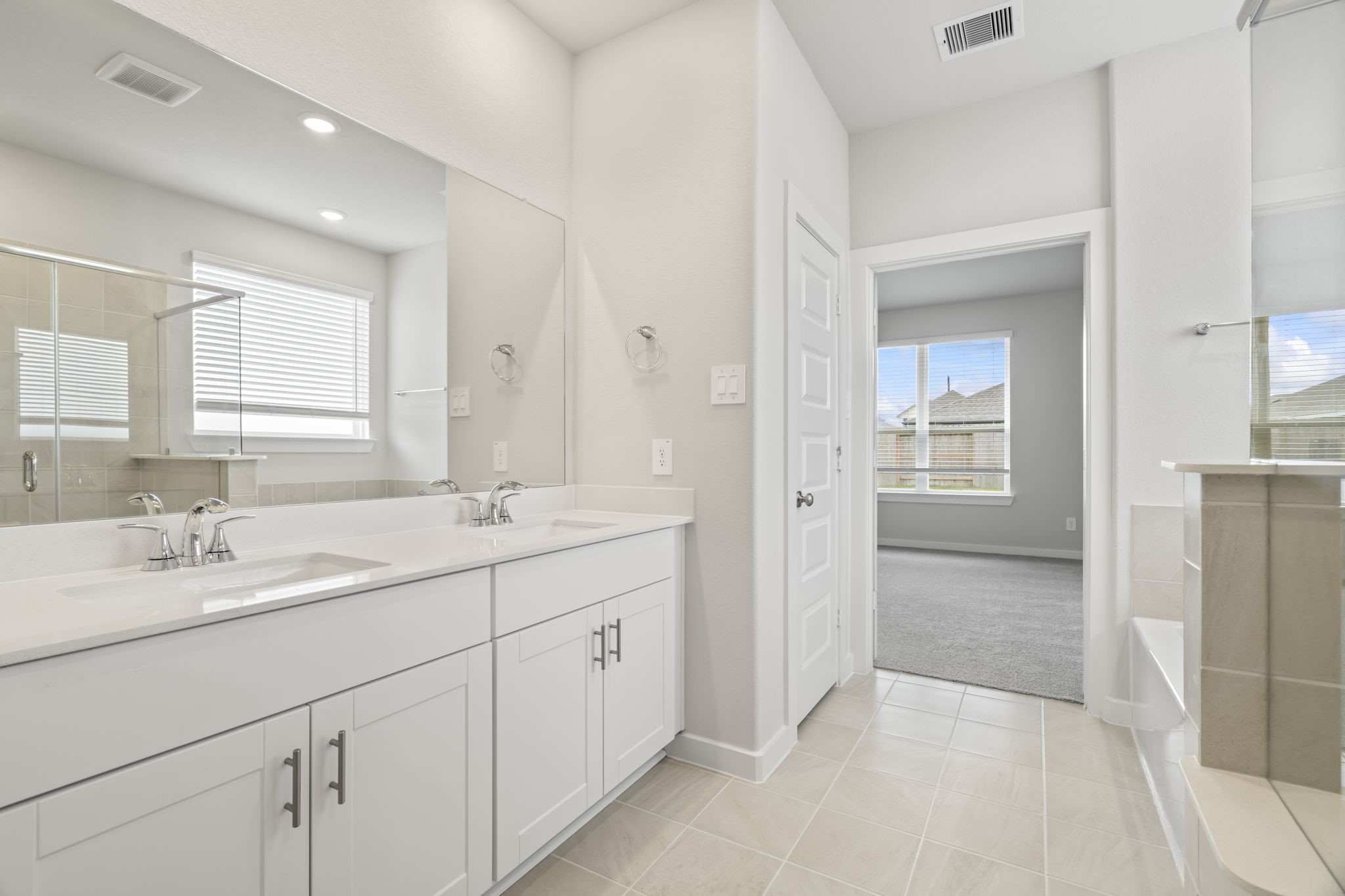 6606 Lenwood Lane Rosharon, TX 77583 - Photo 25 of 33 a spacious bathroom with a double vanity sink a mirror and a shower