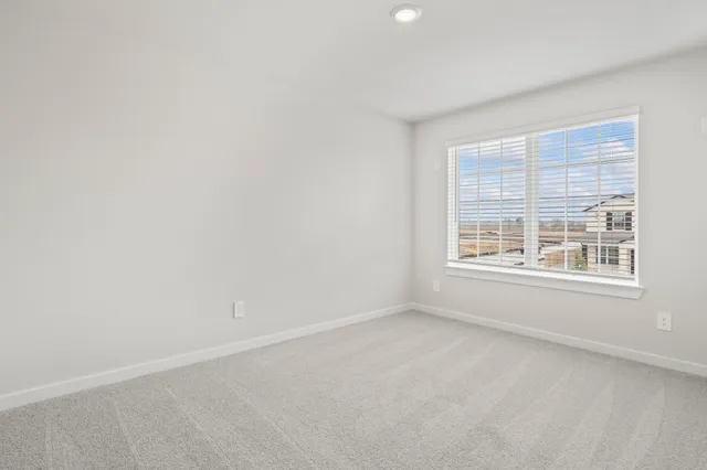 an empty room with closet area