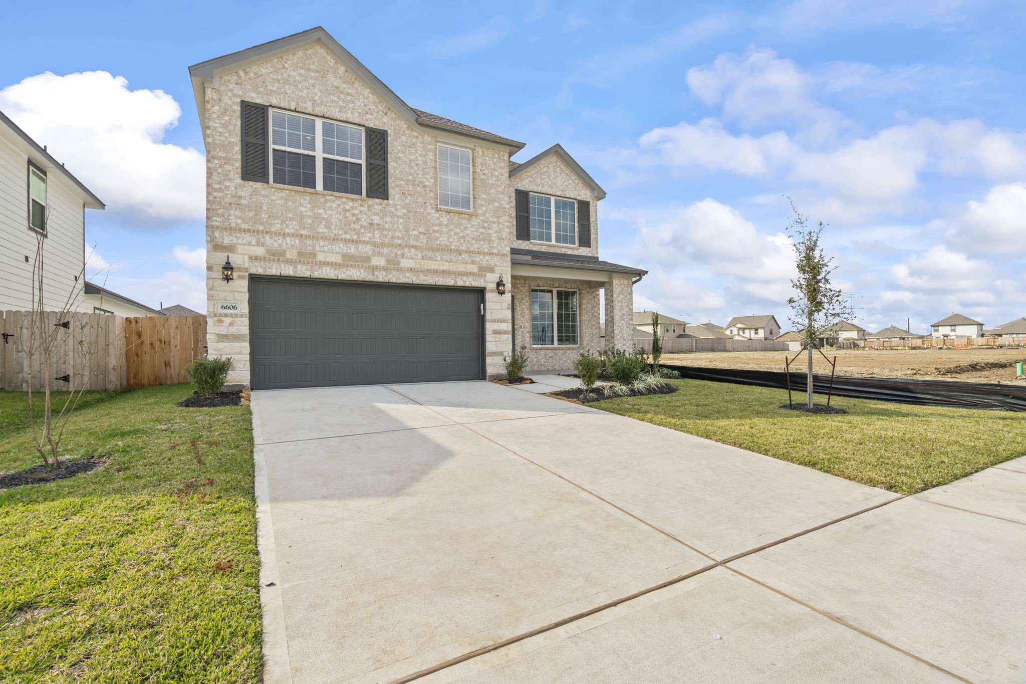 6606 Lenwood Lane Rosharon, TX 77583 - Photo 8 of 33 a front view of a house with a yard and garage