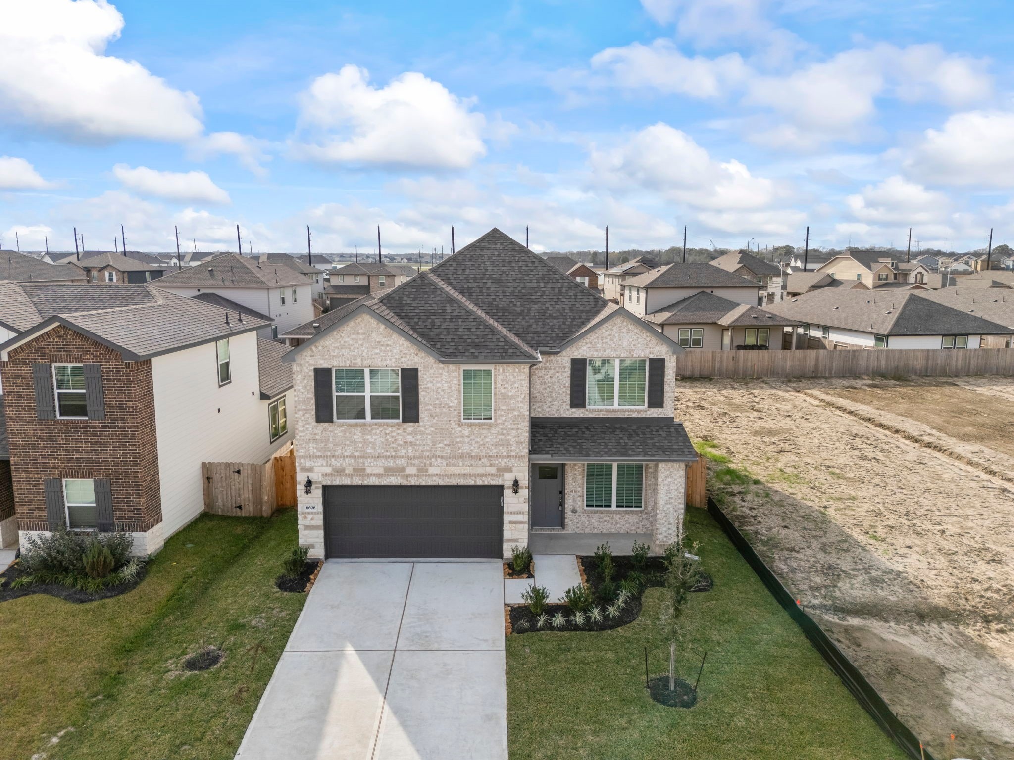 6606 Lenwood Lane Rosharon, TX 77583 - Photo 9 of 33 a front view of a house with a garden and pathway