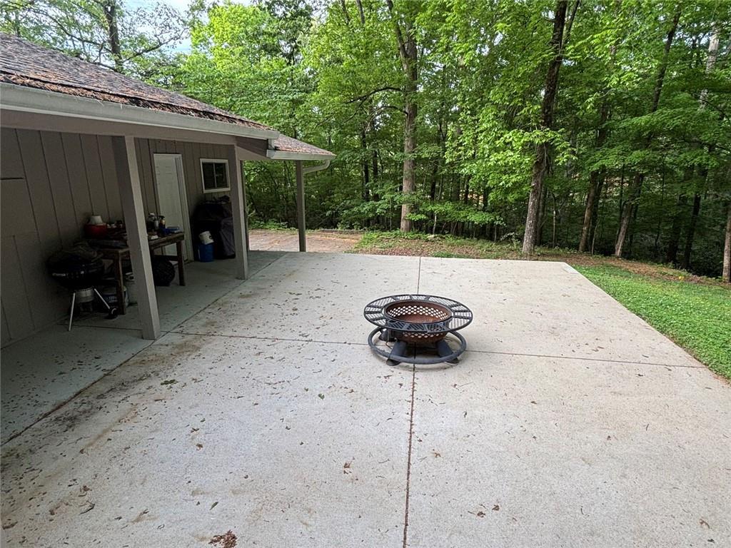 183 Barker Road Southwest Rome, GA 30165 - Photo 14 of 75 a view of a backyard with table and chairs and a large tree