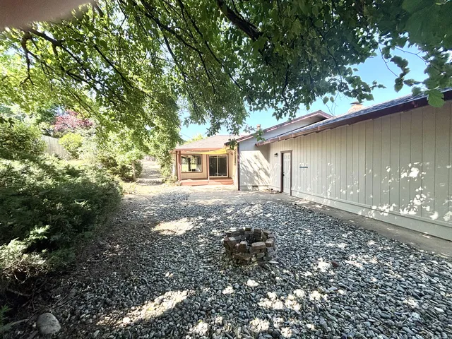 a backyard of a house with lots of green space