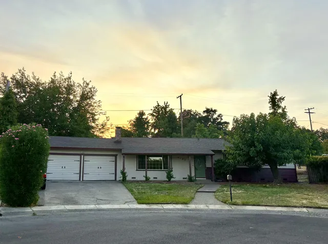 a house view with a garden space