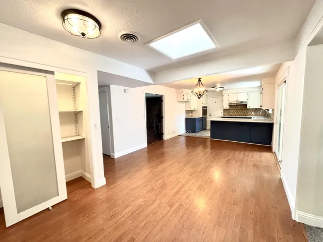 a view of a kitchen from the hallway