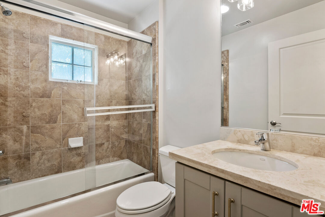 23550 Valley View Road Calabasas, CA 91302 - Photo 17 of 24 a bathroom with a granite countertop sink toilet and shower