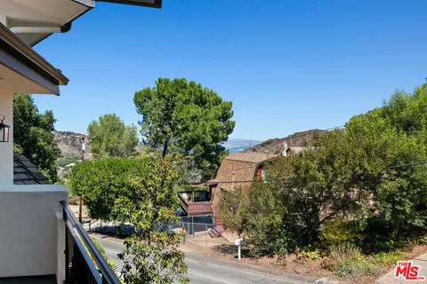 a view of backyard with green space