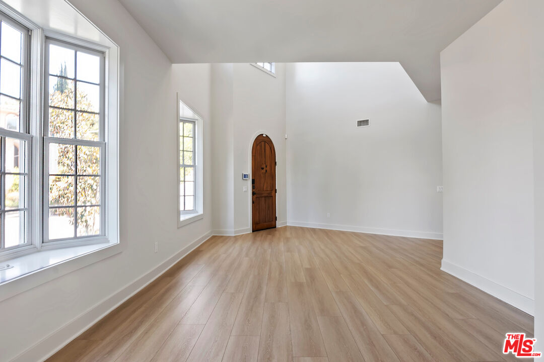 23550 Valley View Road Calabasas, CA 91302 - Photo 2 of 24 a view of a room with wooden floor and window