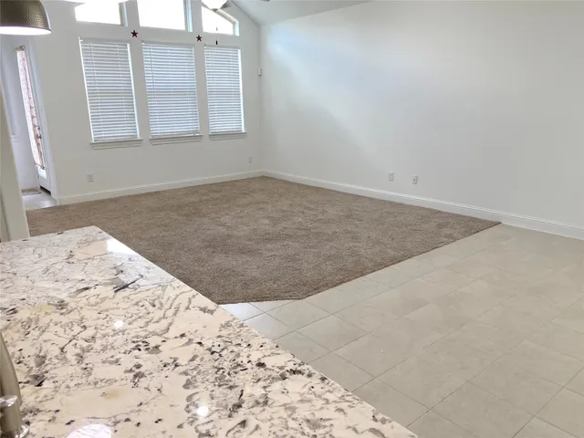 an empty room with a bed