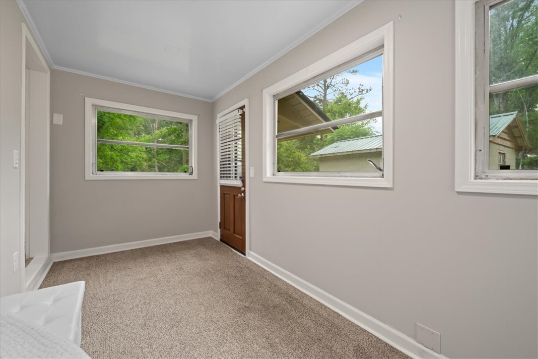 174 Holliday Road Six Mile, SC 29682 - Photo 23 of 49 A quiet retreat with plentiful window views, offering tranquil backyard scenery