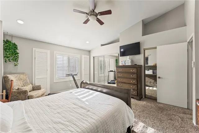 a bedroom with a bed dresser and a window