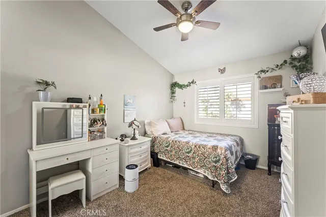 a bedroom with a bed dresser and a window
