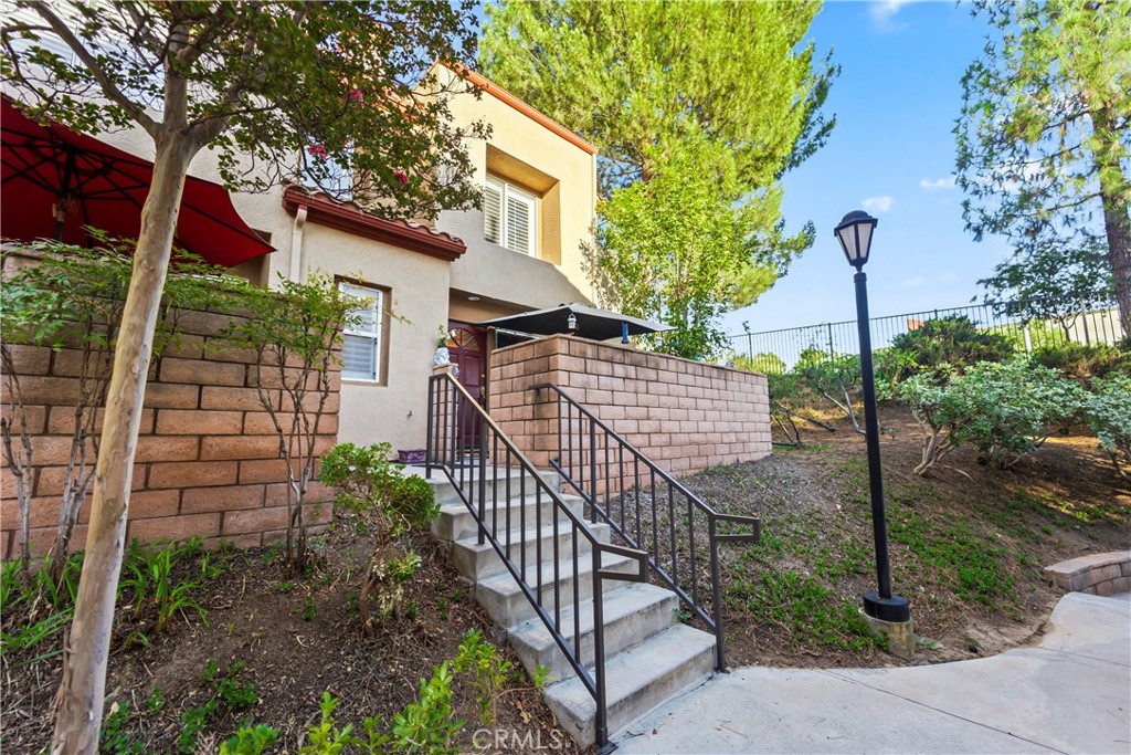 22617 Copper Hill Drive, Unit 121 Saugus, CA 91350 - Photo 20 of 24 a view of a house with iron fence