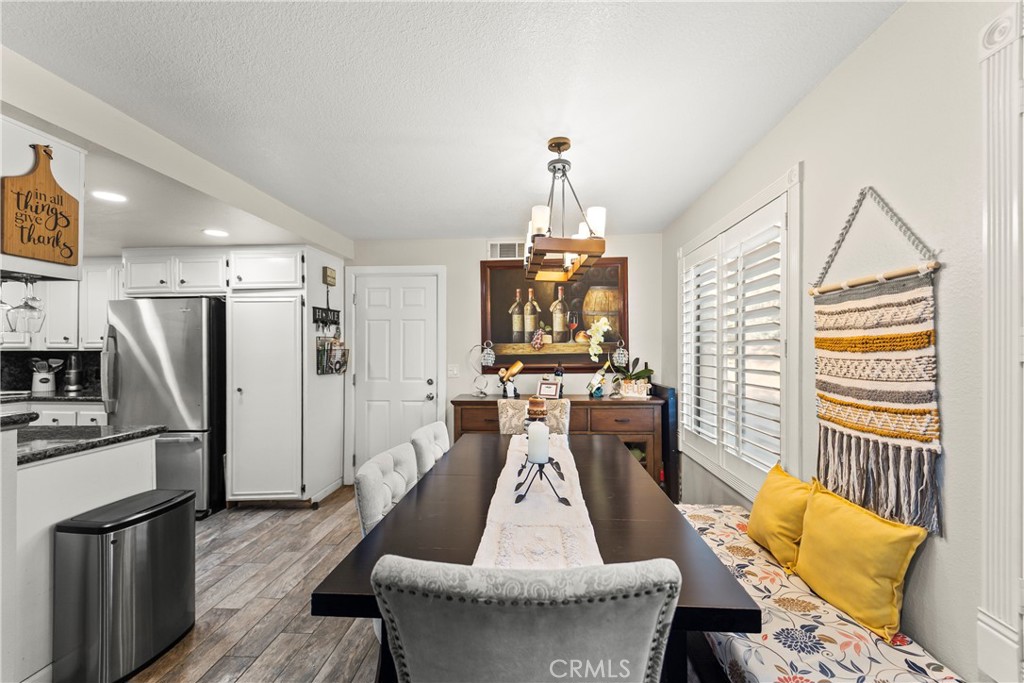 22617 Copper Hill Drive, Unit 121 Saugus, CA 91350 - Photo 4 of 24 a living room with furniture a fireplace and a flat screen tv