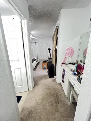 a bed room with a bed and a mirror