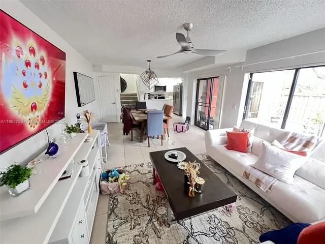 a living room with furniture and flat screen tv