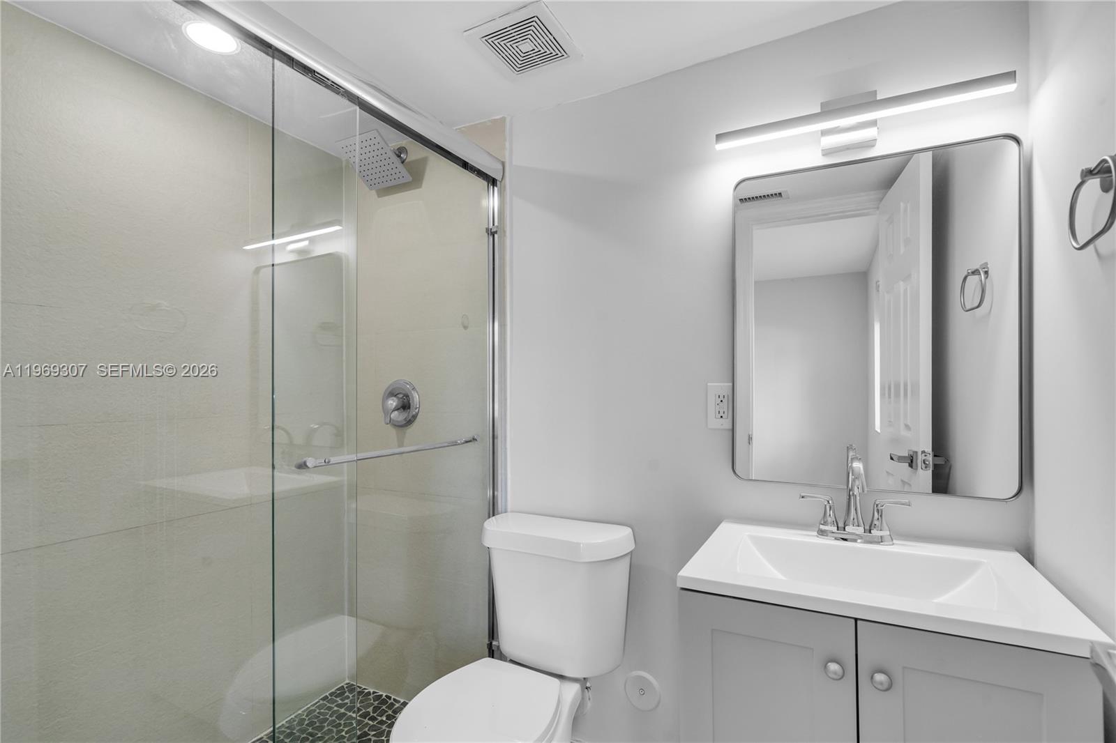 560 Northeast 63rd Street, Unit 3 Miami, FL 33138 - Photo 22 of 23 a bathroom with a sink toilet and shower