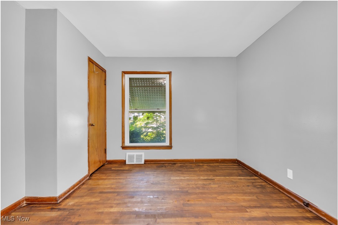 5817 Turney Road Garfield Heights, OH 44125 - Photo 13 of 31 Empty room with wood finished floors