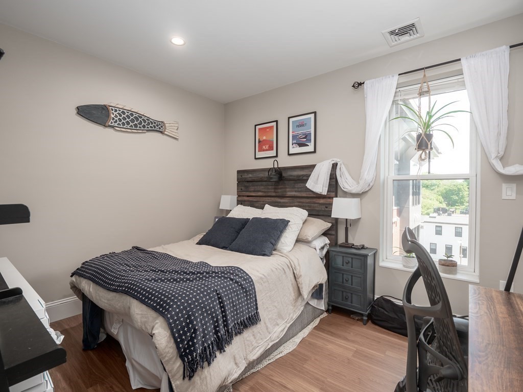 45 L Street, Unit 21 Boston, MA 02127 - Photo 14 of 23 a bedroom with a bed and a window