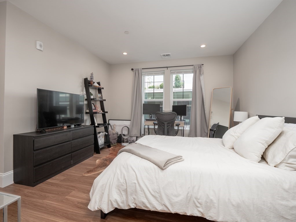 45 L Street, Unit 21 Boston, MA 02127 - Photo 18 of 23 a bedroom with a bed and a flat screen tv