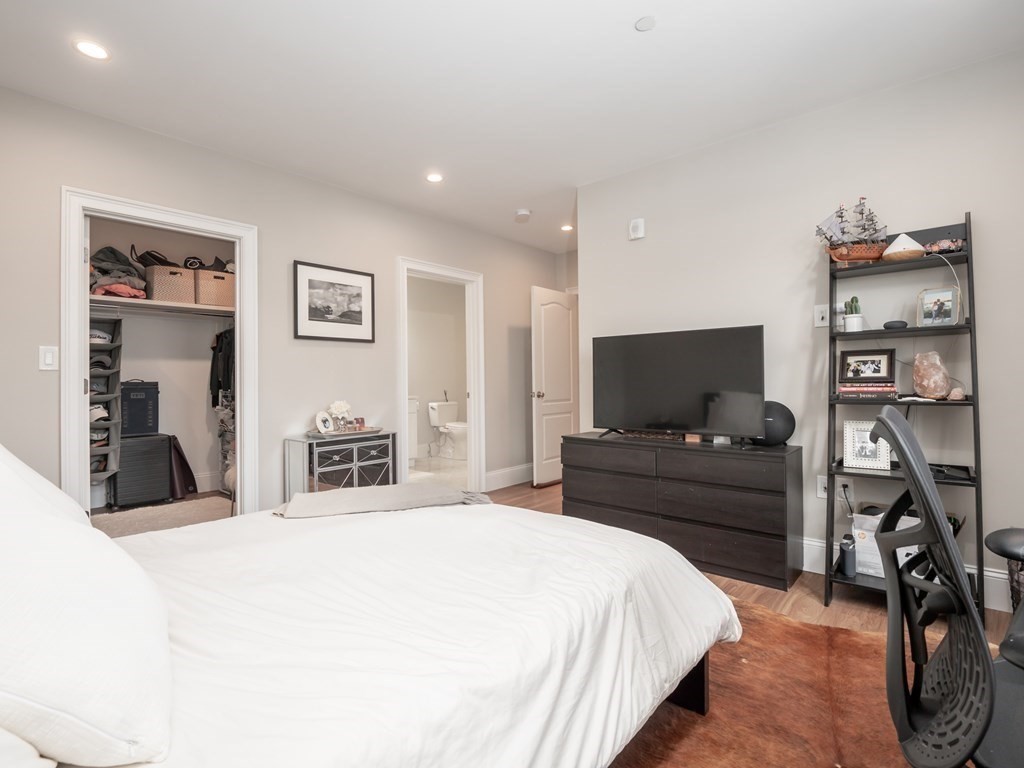 45 L Street, Unit 21 Boston, MA 02127 - Photo 19 of 23 a bedroom with a bed and furniture