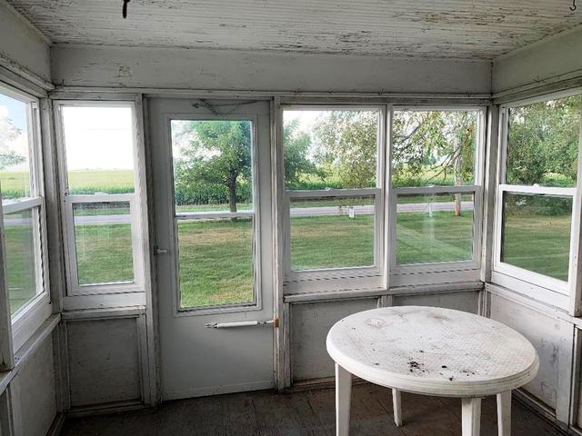 773 Sterling Road Dixon, IL 61021 - Photo 11 of 18 a view of a room that has a bed and a table in it