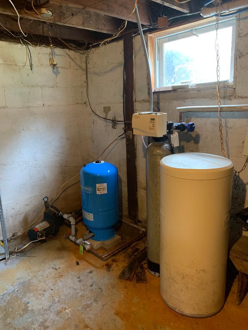 773 Sterling Road Dixon, IL 61021 - Photo 17 of 18 a room with water heater and wooden cabinets