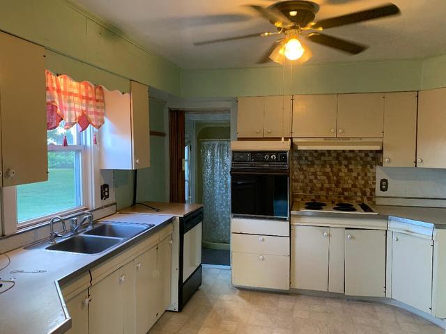 773 Sterling Road Dixon, IL 61021 - Photo 4 of 18 a kitchen with a sink and cabinets