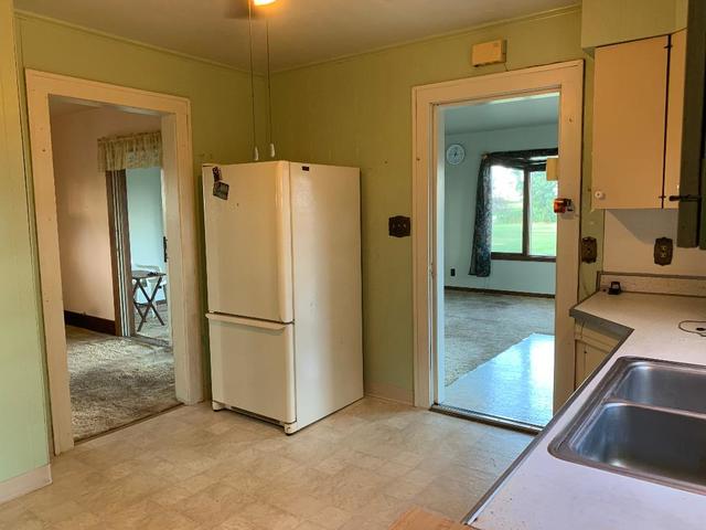 773 Sterling Road Dixon, IL 61021 - Photo 5 of 18 a view of a kitchen with refrigerator and a sink