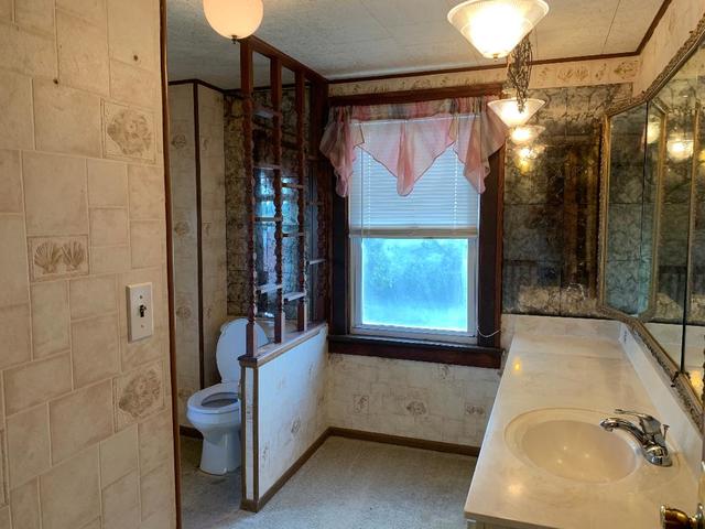 773 Sterling Road Dixon, IL 61021 - Photo 9 of 18 a bathroom with a sink and a mirror
