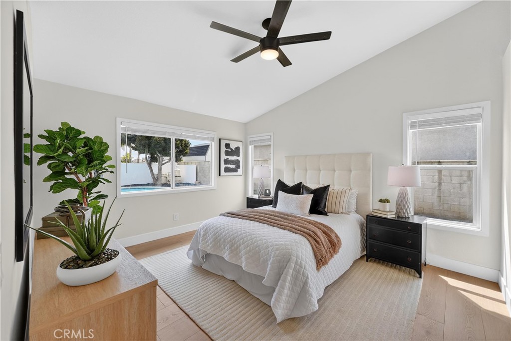 1263 Cornerstone Way Corona, CA 92878 - Photo 11 of 20 a bedroom with a large bed and a potted plant