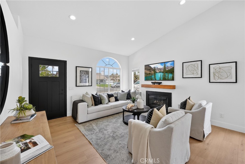 1263 Cornerstone Way Corona, CA 92878 - Photo 2 of 20 a living room with furniture and a fireplace