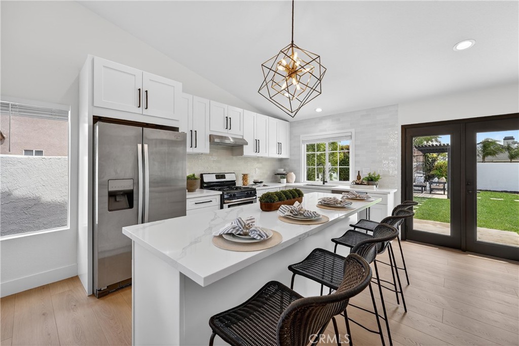 1263 Cornerstone Way Corona, CA 92878 - Photo 5 of 20 a view of a dining room with furniture a chandelier and wooden floor