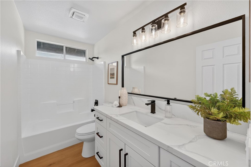 1263 Cornerstone Way Corona, CA 92878 - Photo 10 of 20 a bathroom with a bathtub shower sink and toilet