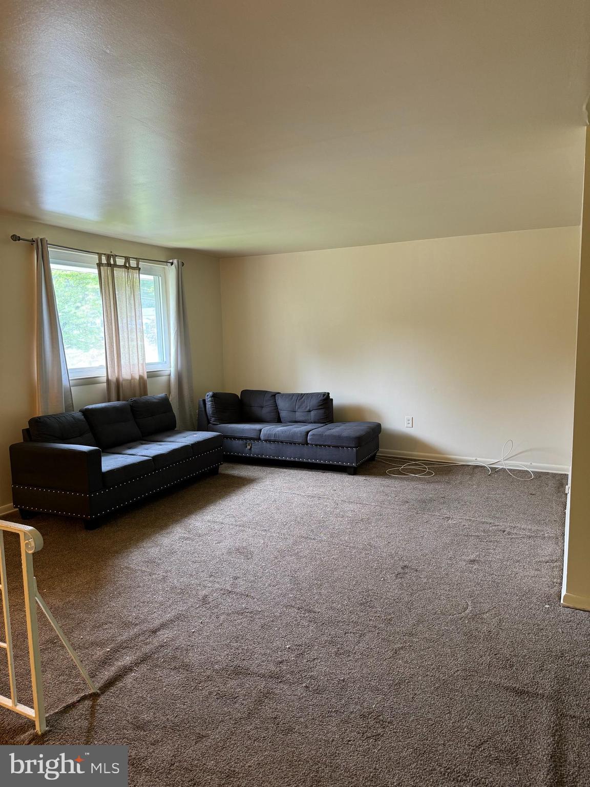 9401 Cheltenham Avenue Clinton, MD 20735 - Photo 2 of 16 a living room with furniture and a flat screen tv