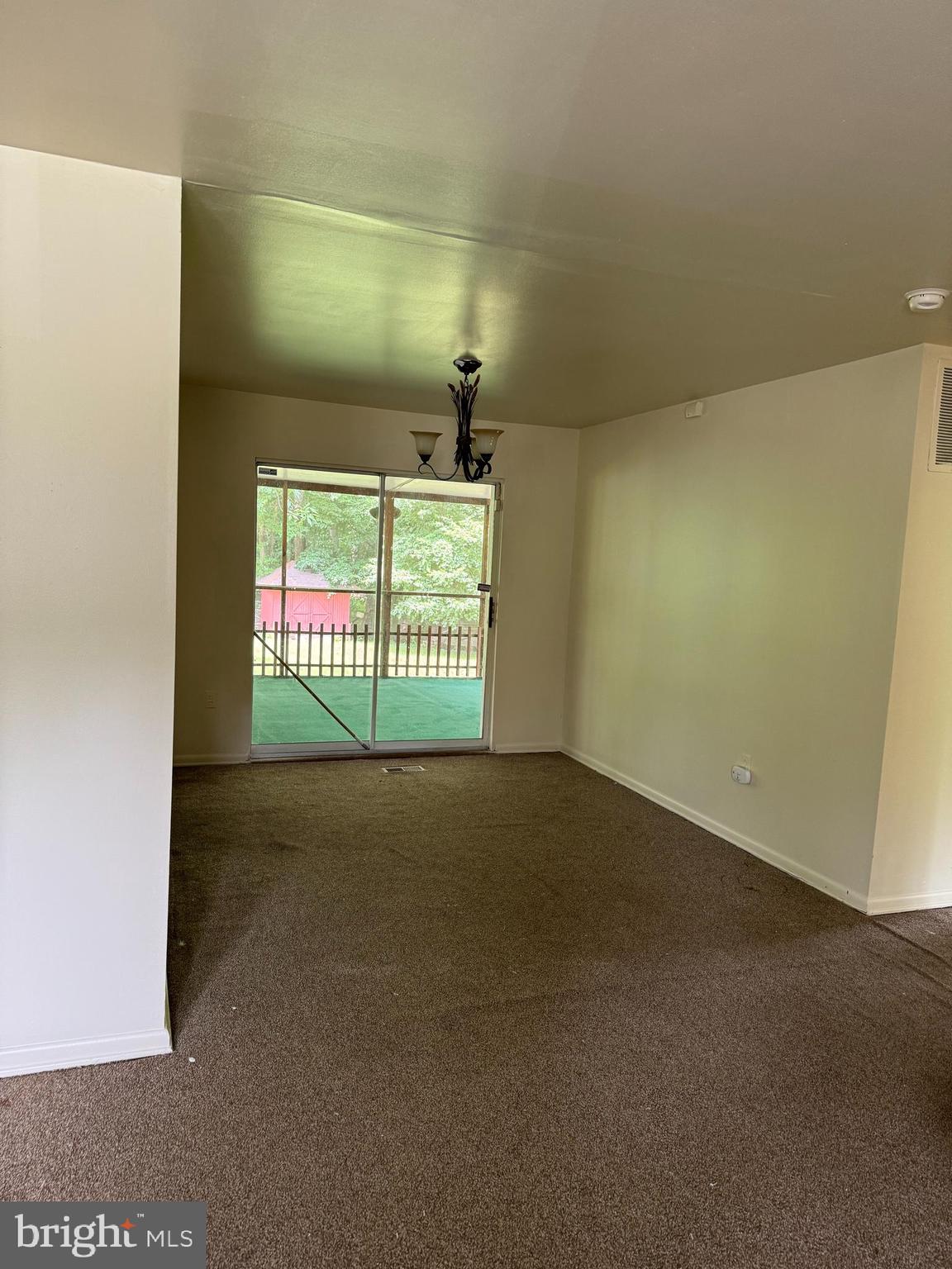 9401 Cheltenham Avenue Clinton, MD 20735 - Photo 4 of 16 a view of an empty room with a window