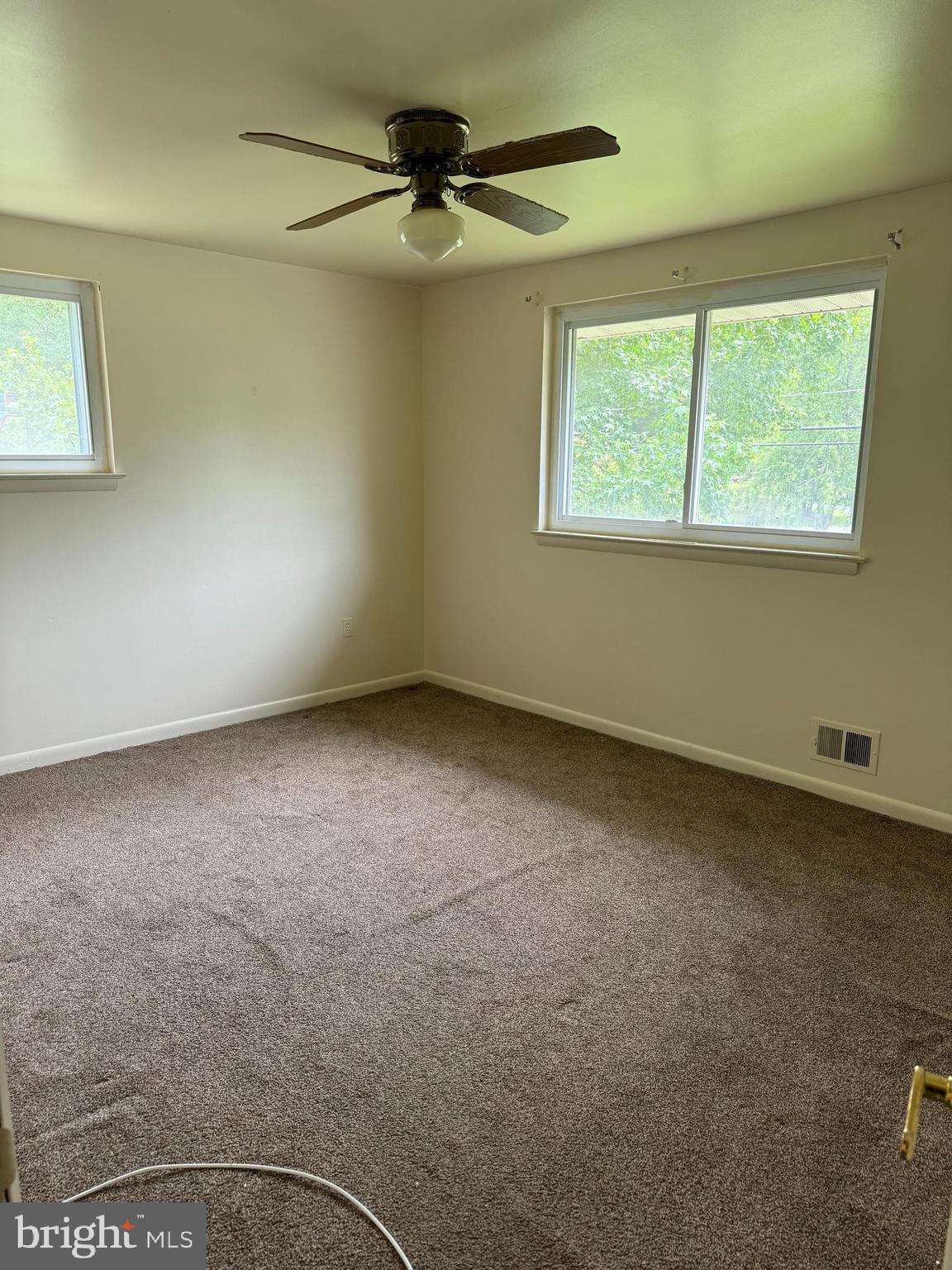 9401 Cheltenham Avenue Clinton, MD 20735 - Photo 7 of 16 a view of an empty room with a window