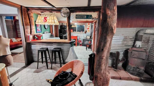 a dining room with furniture and a fireplace