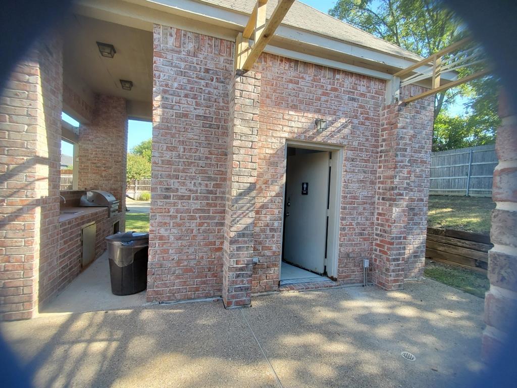 6812 Cold Water Canyon Road Fort Worth, TX 76132 - Photo 14 of 15 a view of a brick house with outdoor space