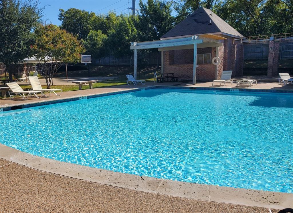 6812 Cold Water Canyon Road Fort Worth, TX 76132 - Photo 15 of 15 a view of a house with backyard sitting area and swimming pool
