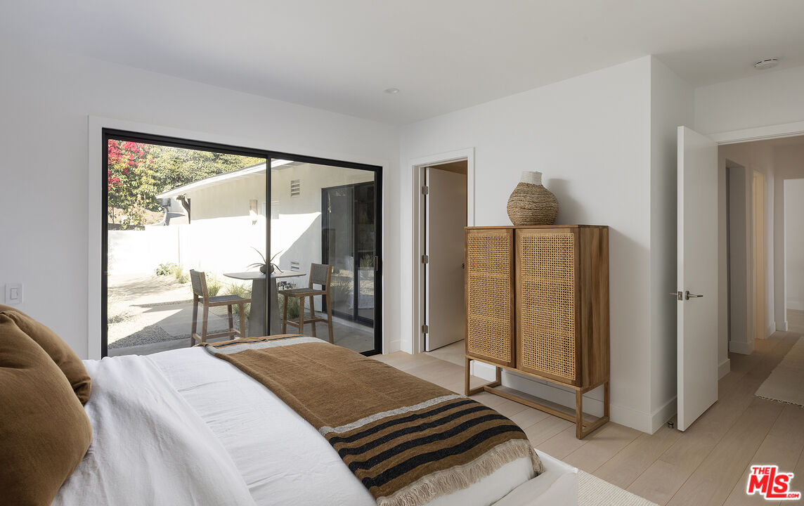 20374 Seaboard Road Malibu, CA 90265 - Photo 21 of 43 a bedroom with a bed and large window