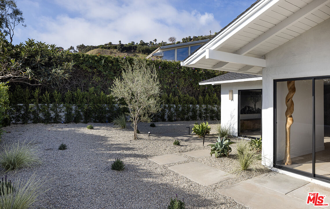 20374 Seaboard Road Malibu, CA 90265 - Photo 27 of 43 a view of a house with backyard and sitting area