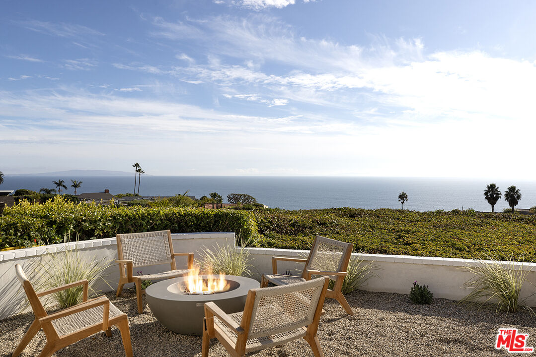 20374 Seaboard Road Malibu, CA 90265 - Photo 29 of 43 a view of a terrace with furniture and city view