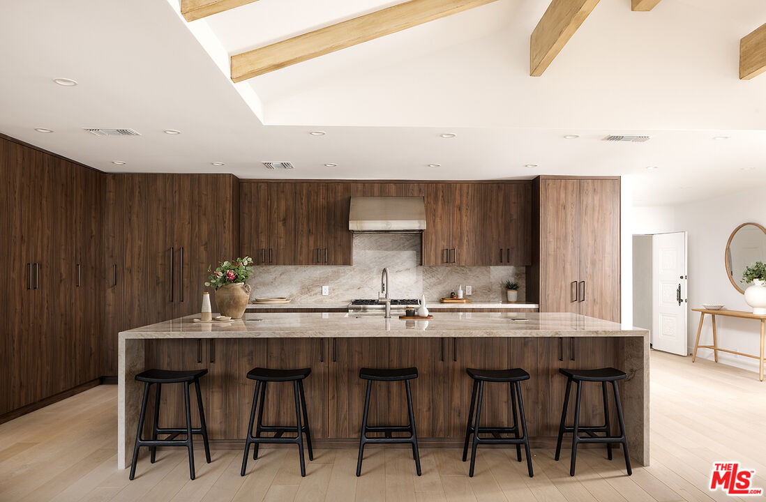 20374 Seaboard Road Malibu, CA 90265 - Photo 7 of 43 a dining table with chairs and wooden floor