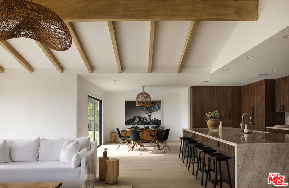 20374 Seaboard Road Malibu, CA 90265 - Photo 9 of 43 a living room with furniture a clock and a window