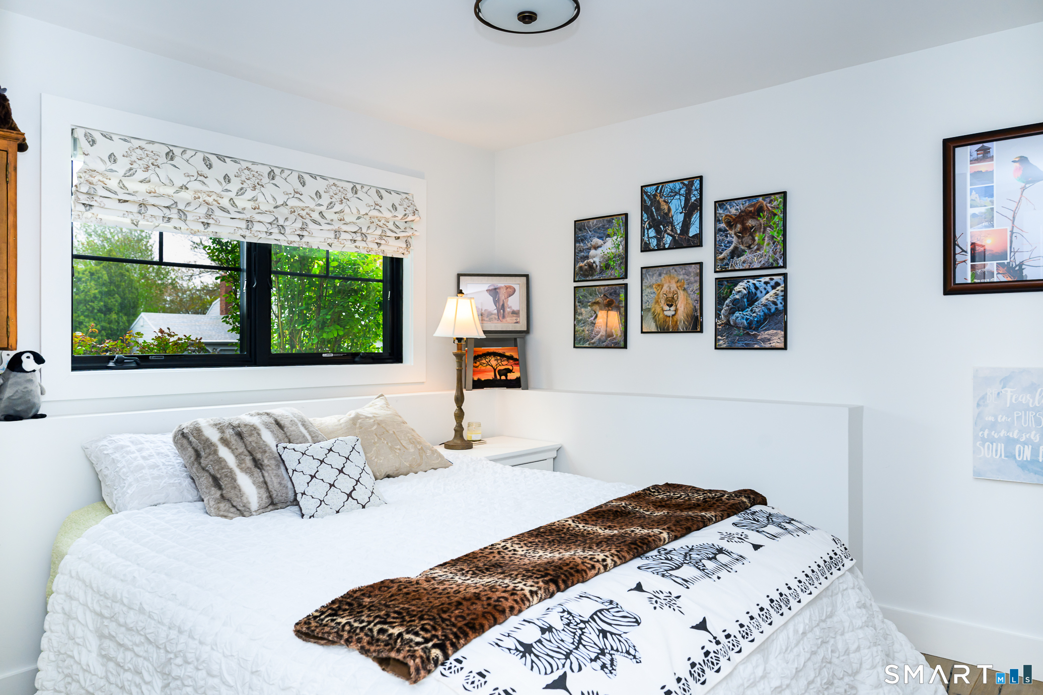 8 East Wharf Road Waterford, CT 06385 - Photo 22 of 40 a bedroom with a large bed and a window
