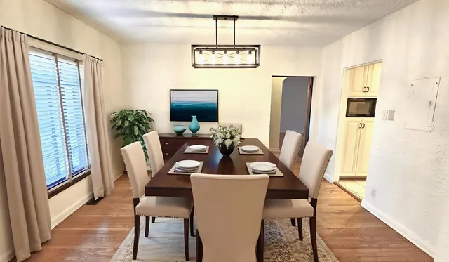 a view of a livingroom with wooden floor