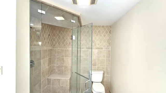 a spacious bathroom with a granite countertop sink and a bathtub