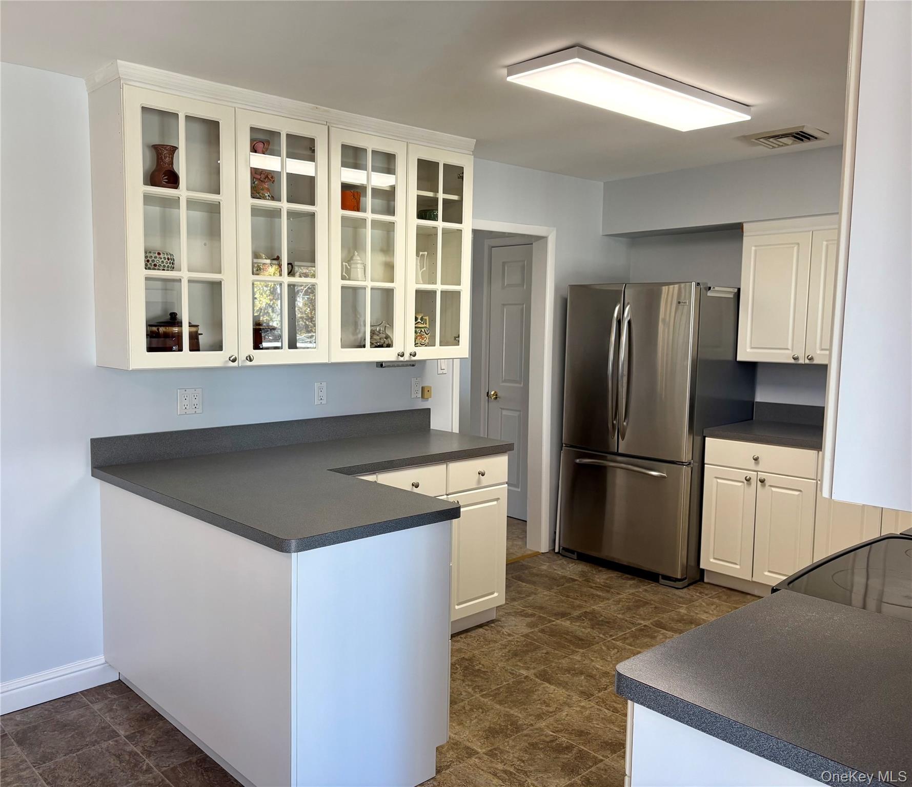 223 Timber Point Road East Islip, NY 11730 - Photo 15 of 47 a kitchen with a refrigerator stove and sink