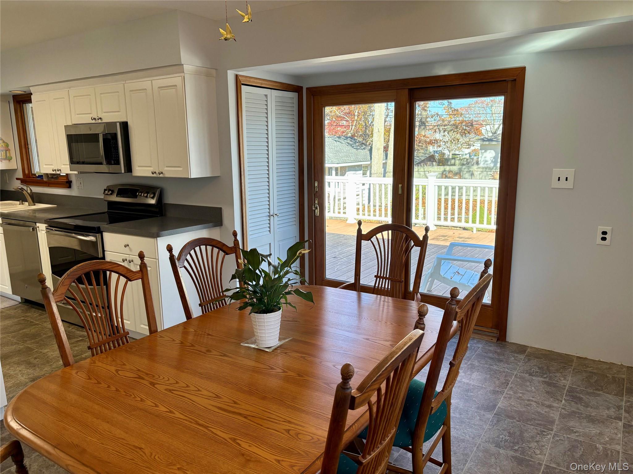 223 Timber Point Road East Islip, NY 11730 - Photo 16 of 47 a view of a dining room with furniture window and wooden floor