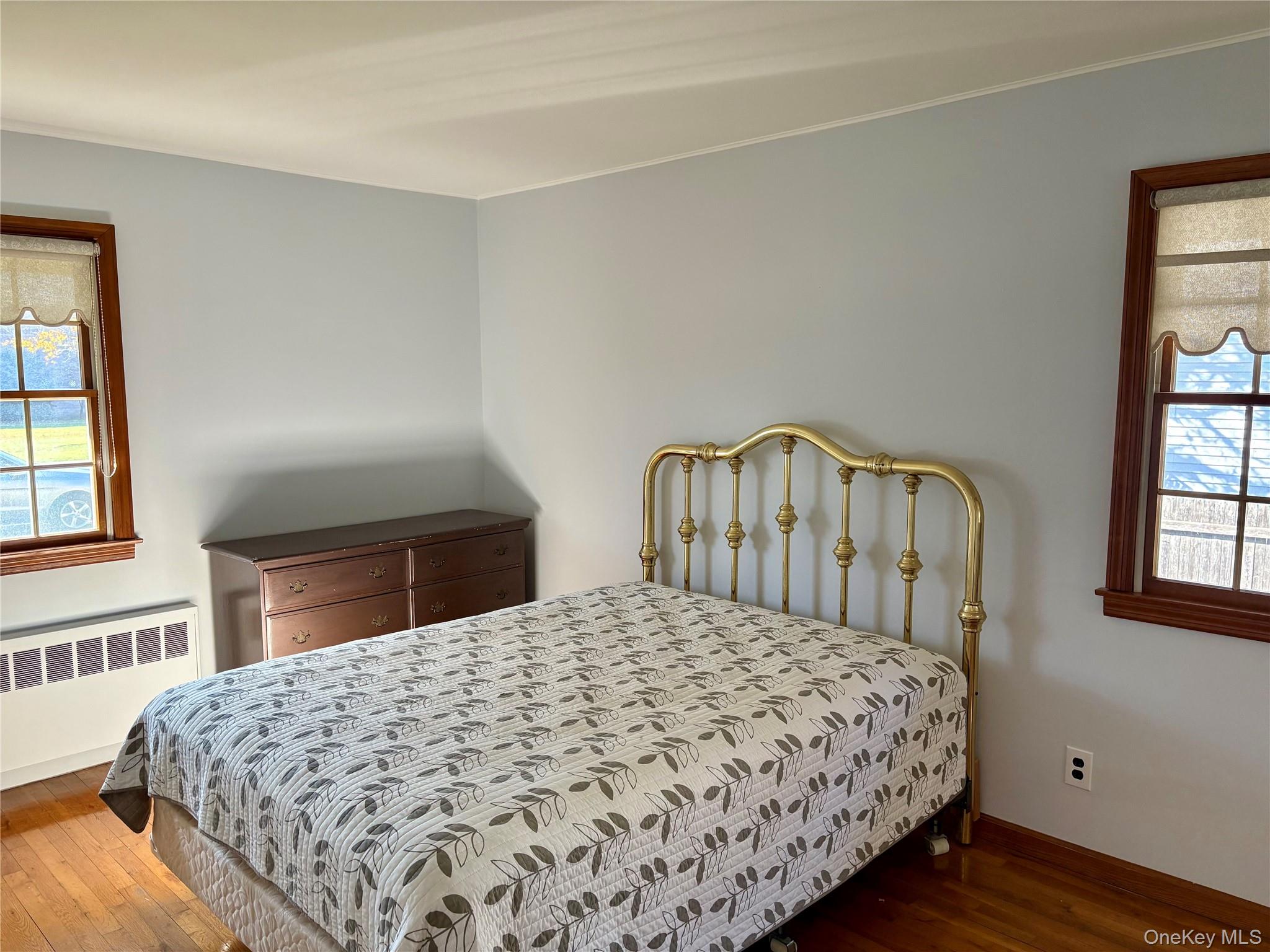 223 Timber Point Road East Islip, NY 11730 - Photo 21 of 47 a bedroom with a bed and a window